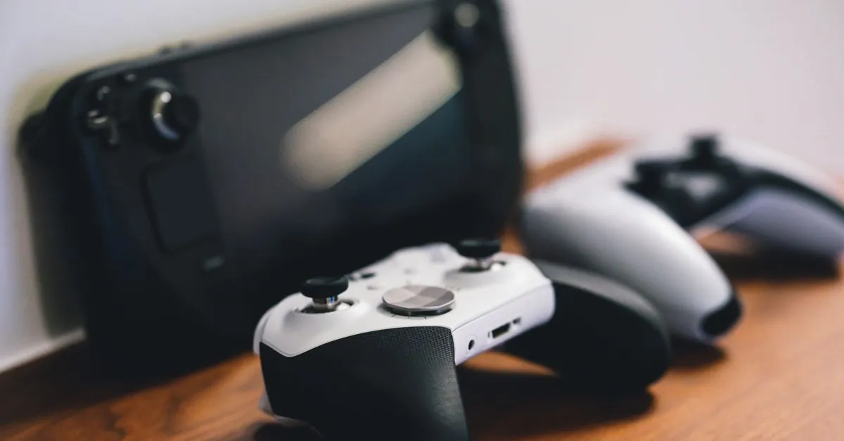 Game controllers and a console on a wooden surface